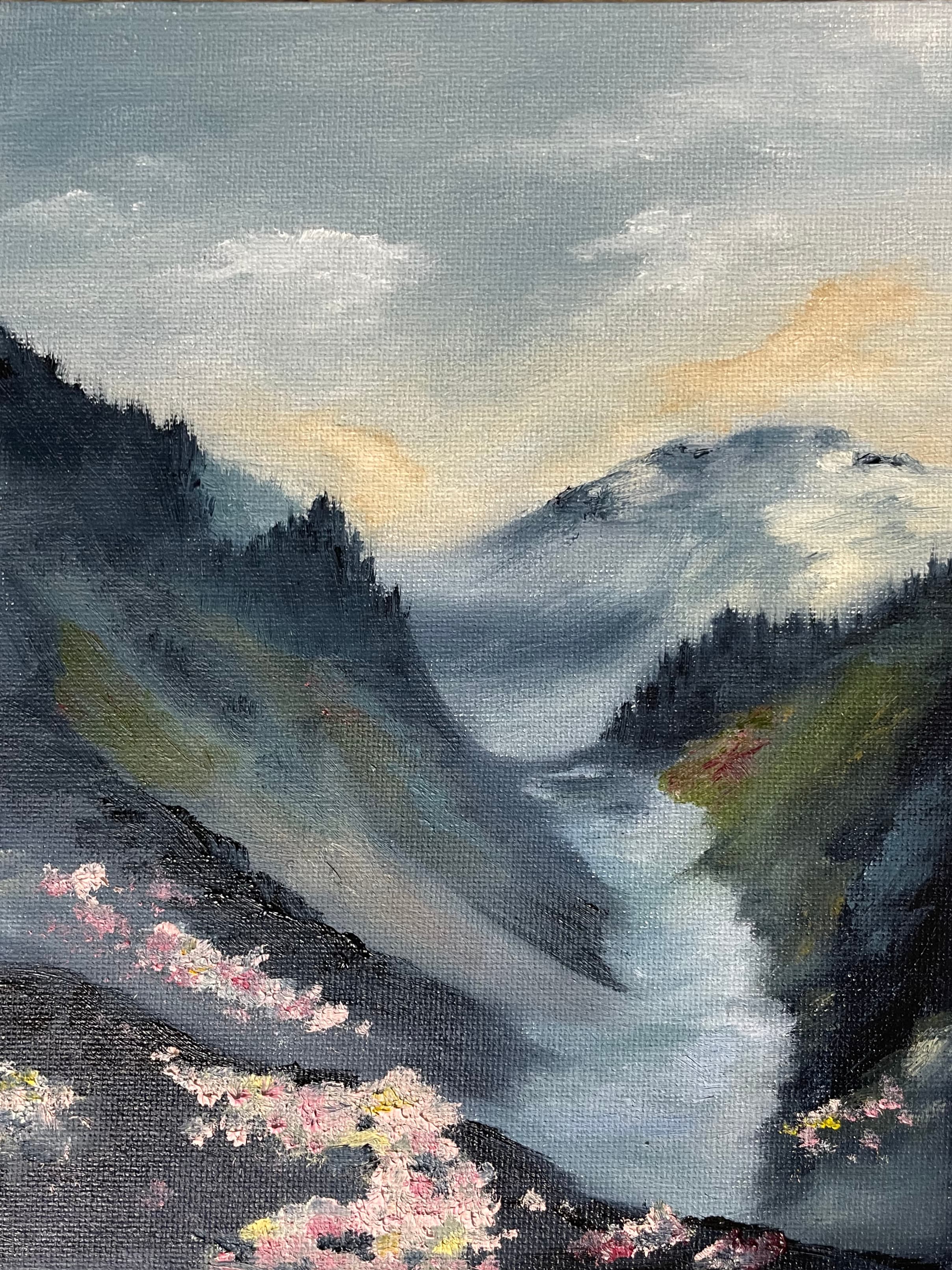 Oil painting of a misty valley with a river winding between dark forested slopes, pink blossom on the rocks in the foreground