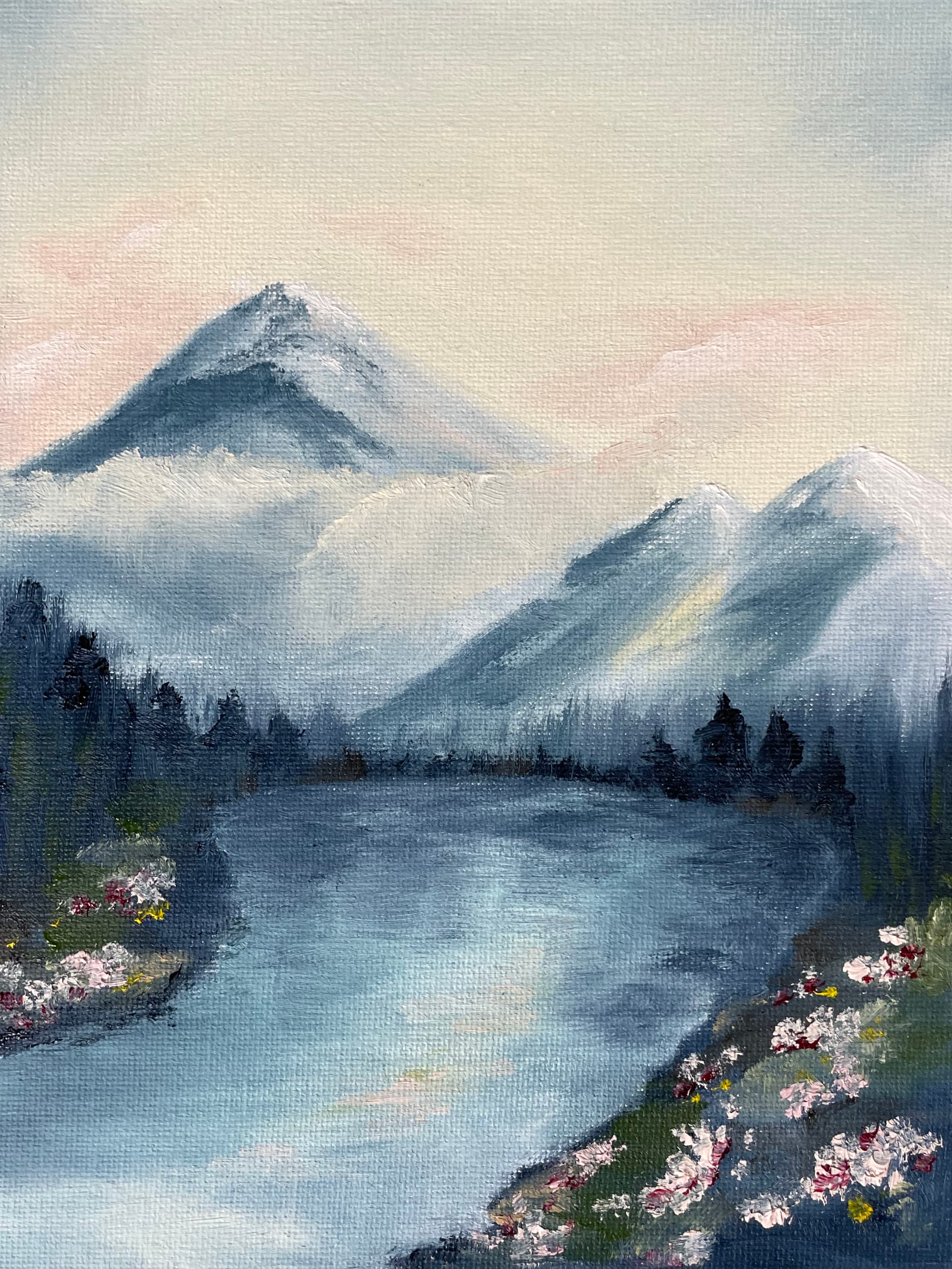 Oil painting of a blue mountain lake under a pale pink sky, a snow-capped peak rising through cloud and wildflowers along the near shore